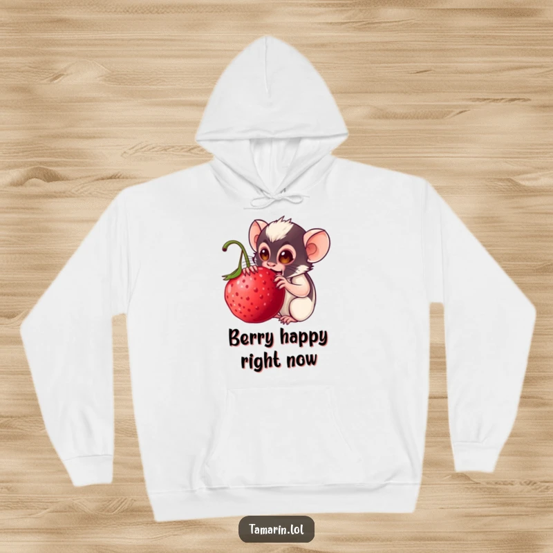 Funny tamarin hoodie: a content monkey wearing a warm hoodie, happily snacking on an enormous, ripe berry, conveying warmth and humor.