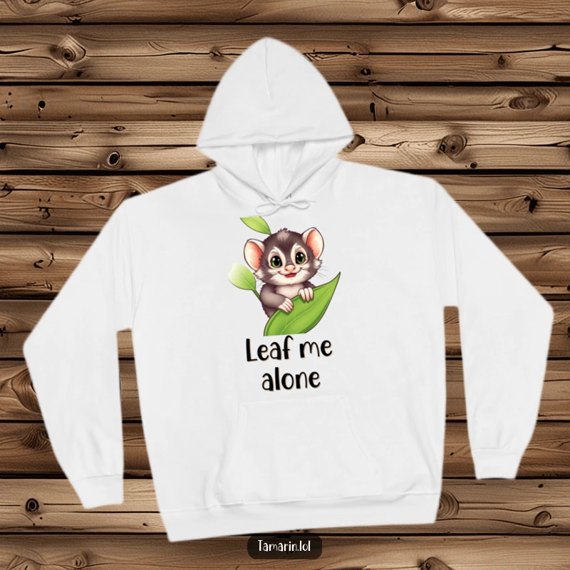 Funny Hoodie: A tamarin peeks from a leaf with a sly grin, suggesting playful secrets, a perfect funny gift.