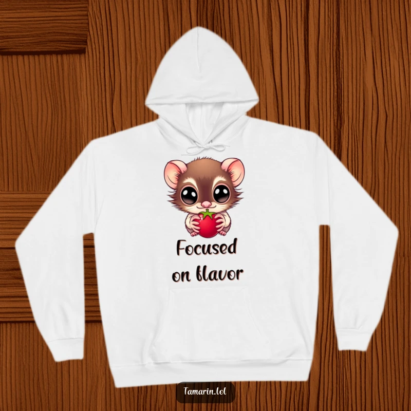 Funny hoodie featuring a wide-eyed tamarin fixated on a juicy berry, expressing intense anticipation, a fantastic funny gift for primate enthusiasts.