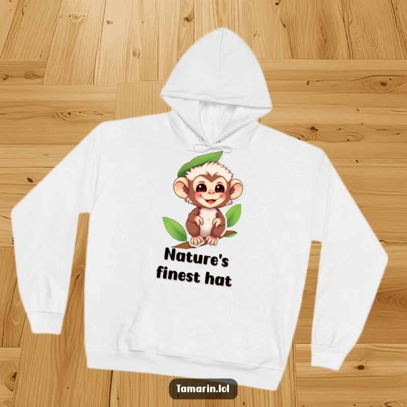 Funny tamarin monkey hoodie depicting a smiling primate wearing a leaf as a hat, offering warmth and woodland amusement.