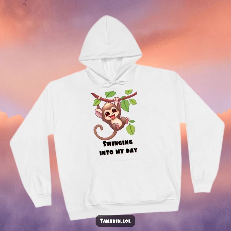 Funny tamarin monkey swinging exuberantly from a vine, captured on a warm hoodie for adventurous souls.