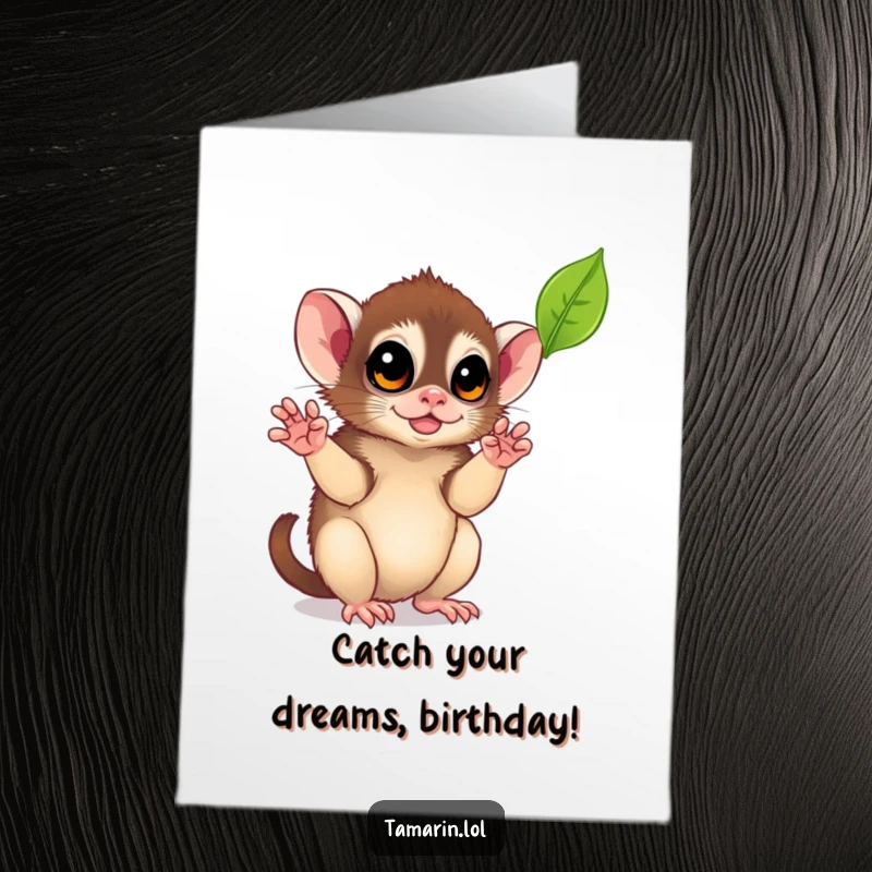 Free Printable Birthday Card showing a cute tamarin reaching with tiny hands to playfully catch a falling autumn leaf.