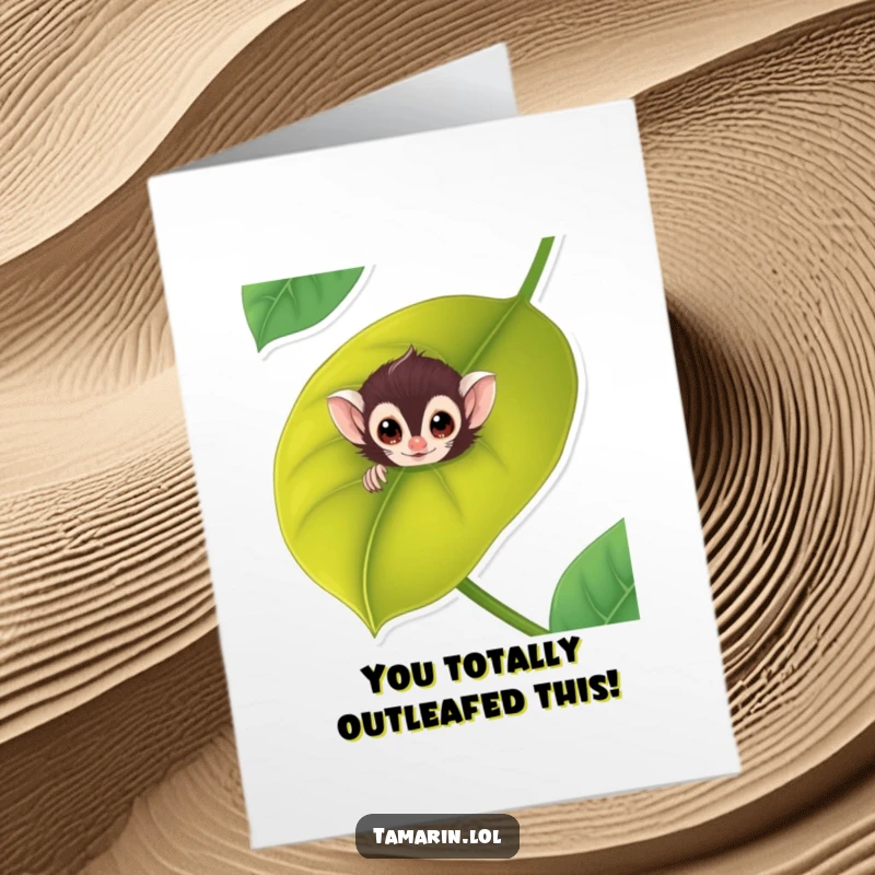 Funny Free Printable Tamarin Congratulations Card: A cheeky monkey pops out from behind a lush leaf, offering congratulations with a grin.