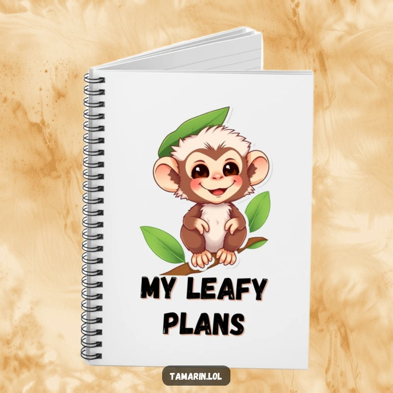 Funny tamarin monkey notebook featuring a smiling primate wearing a leaf hat, ideal for notes with woodland charm.